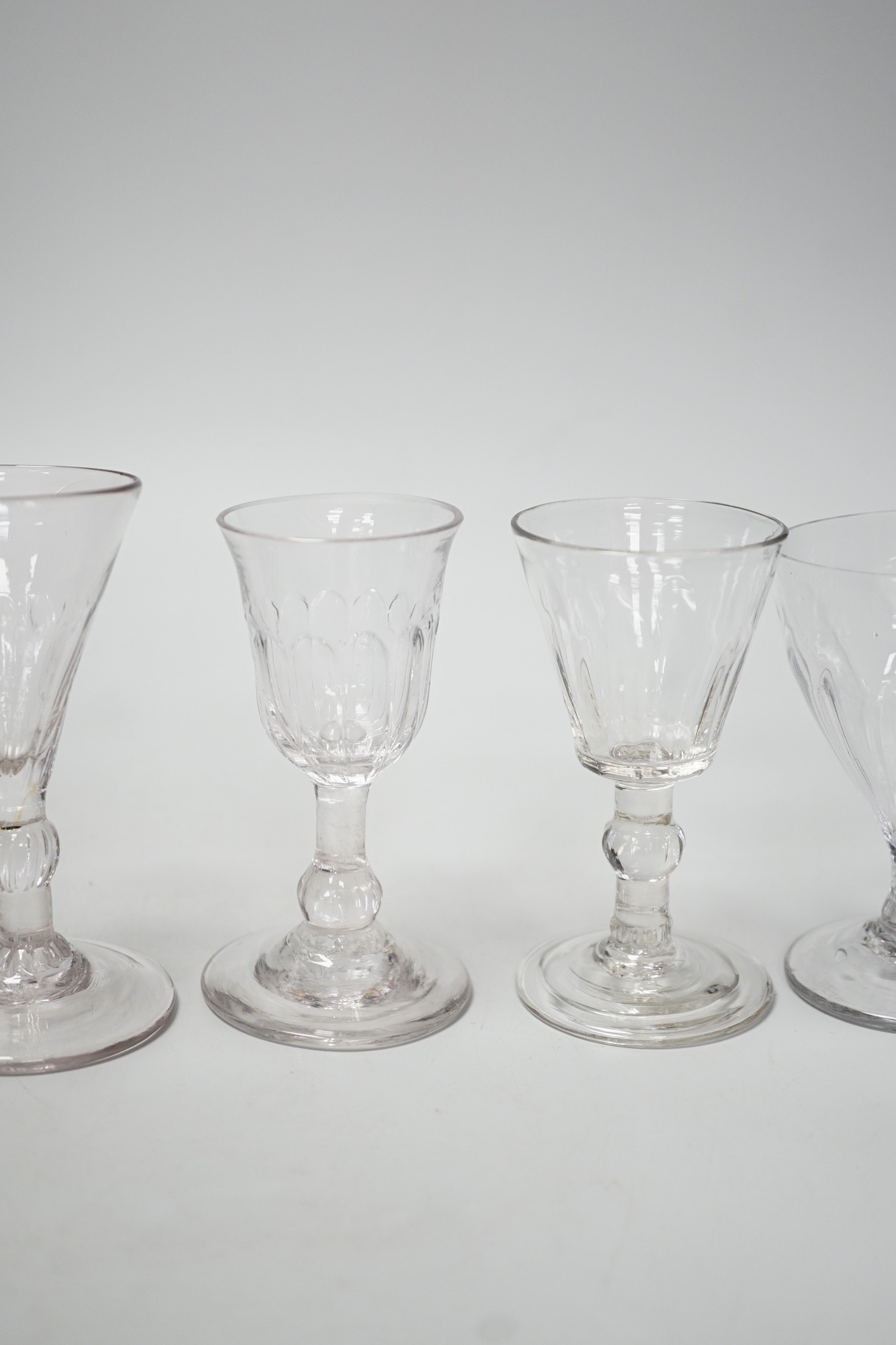 A small Georgian glass rummer and five cordials. Tallest 12cm